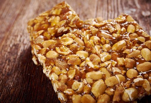 Peanut brittle sweet hard on wooden table