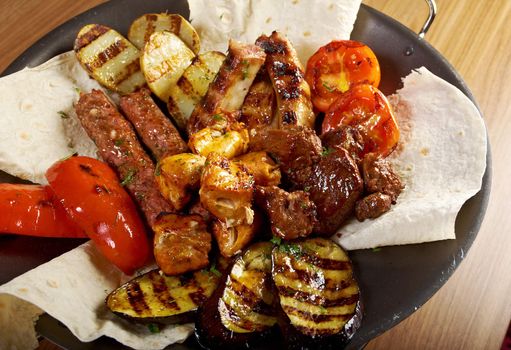 Shashlik (shish kebab). Various types  mat roasted with vegetable closeup