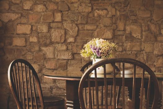 vintage chair and table with flower