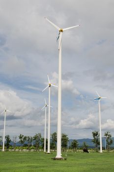 many white windmill in farmland