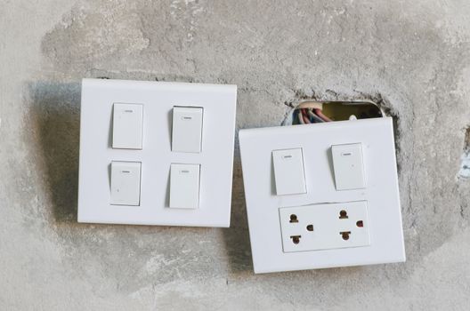 white electricity switch on the wall