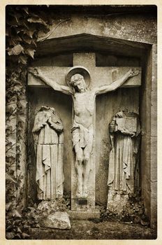 Vintage religious postcard of Jesus on the cross surrounded by two headless unidentified persons.