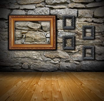 interior backdrop  with stone wall and wooden floor - some ancient empty  painting frames ready for your design
