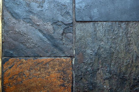 closeup of textured tiles made from grungy gray stone