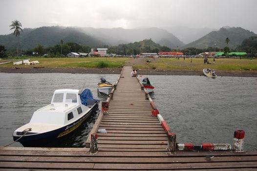 Timber pier with boat, Alotau, Papua New Guinea