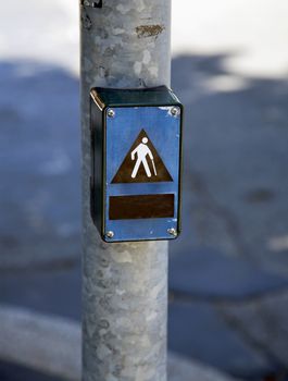 Symbol of disabled person over a pole