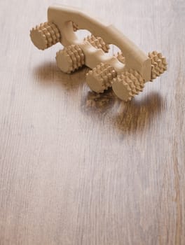 one massager on wooden background