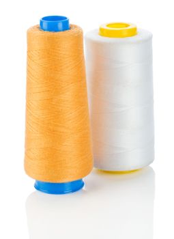 orange and white thread on spools isolated