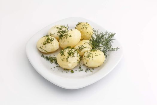 Boiled potatoes with dill on a white background, not isolated