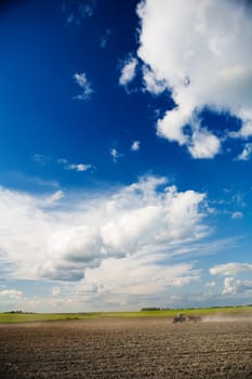 sky and field with tractor