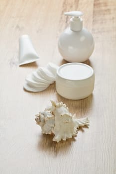 tube bottles cotton pads and cockleshell
