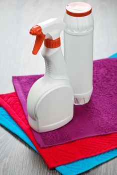 two bottles on towels
