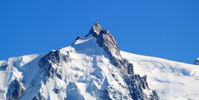 The Aiguille du Midi (3,842 m) is a mountain in the Mont Blanc massif in the Alps with a panoramic viewing platform to Chamonix, France