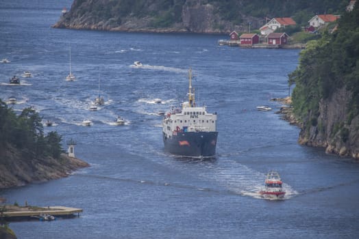 Hurtigruten (the Express Route) Ms Ragnvald Jjarl was built in 1956 and called today MS Sj��kurs and serves as a training ship. NRK (Norwegian Broadcasting Corporation) has chartered the vessel to produce a program called Summer Open. The ship will sail along the entire Norwegian coast and filming at each port. The photos are shot while the ship is heading to the port of Halden