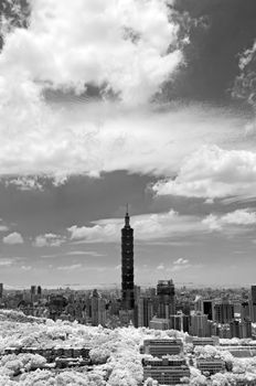 Taipei cityscape with famous landmark, 101 skyscraper under dramatic sky, infrared photography. Shoot at Taipei, Taiwan, Asia.