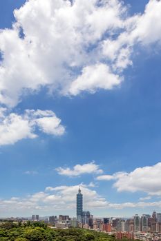 Cityscape of Taipei with skyscraper under dramatic clouds at blue sky in Taiwan, Asia.