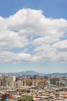 Cityscape of Taipei with skyscraper under dramatic clouds at blue sky in Taiwan, Asia.