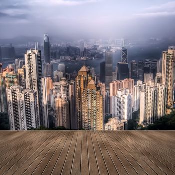Cityscape of Hong Kong skyscrapers and skyline with wooden ground.