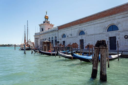 ITALY, VENICE - JULY 2012: Floating at Grand canal on July 16, 2012 in Venice. The canal forms the major water-traffic corridors in the city. 