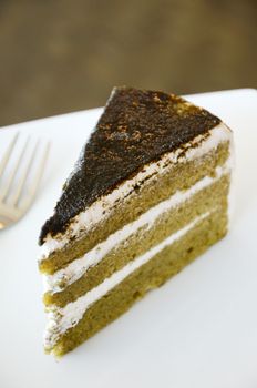 Matcha green tea cake in white dish