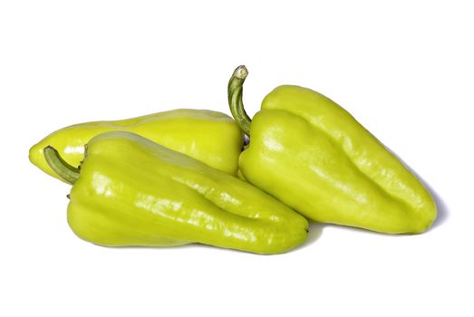 Green peppers on a white background with shadow.