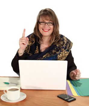 Middle aged businesswoman holds up number one sign at her laptop.