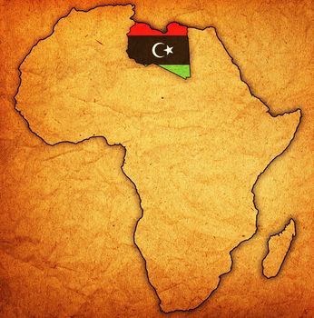 libya on actual vintage political map of africa with flags