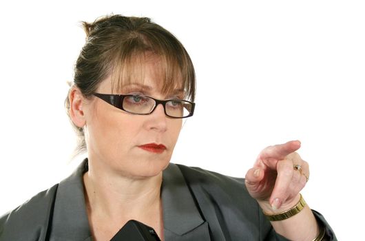 Serieous middle aged businesswoman gesticulating and pointing.