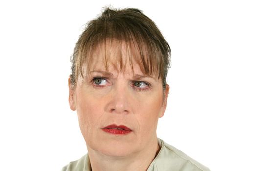 Middle aged female looking away with a frown.