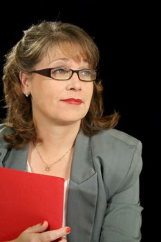 Mature businesswoman executive with red folder.