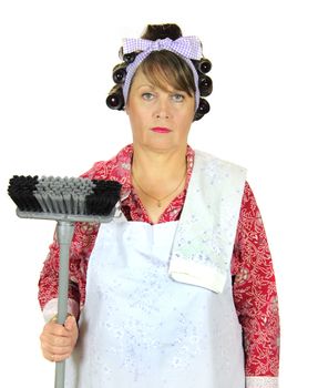 Unhappy and apathetic frumpy housewife standing with broom.