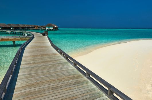 Beautiful beach with water bungalows at Maldives