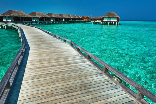 Beautiful beach with water bungalows at Maldives