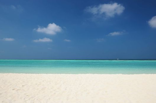 Crystal clear turquoise water at tropical maldivian beach