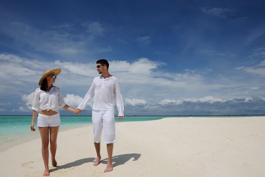 Couple on a tropical beach at Maldives