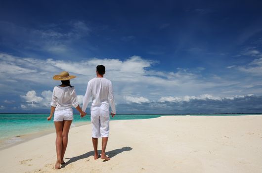 Couple on a tropical beach at Maldives