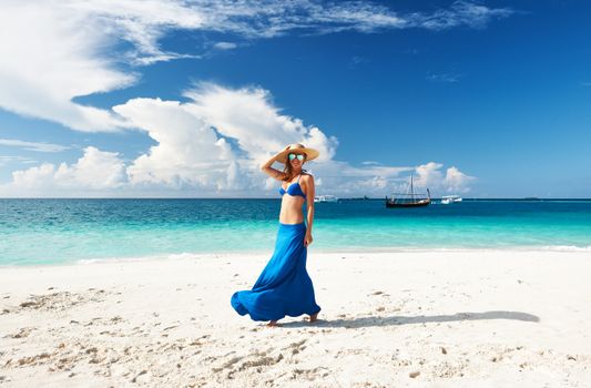 Woman in skirt at tropical beach