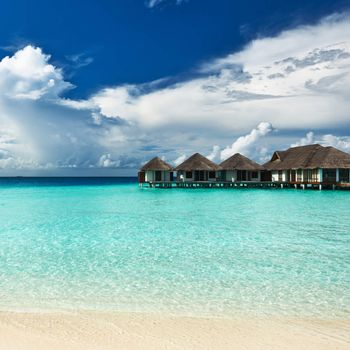 Beautiful beach with water bungalows at Maldives