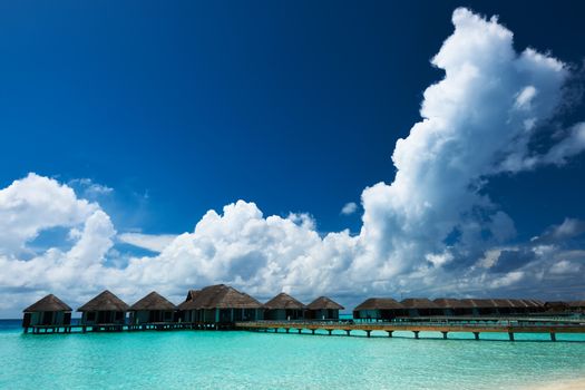Beautiful beach with water bungalows at Maldives
