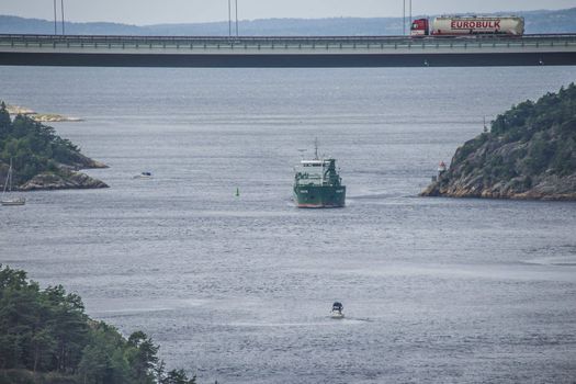 Cargo ship Kalkvik  going to the port of Halden, Norway in order to unload clay. The picture is shot from Svinesund Bridge.