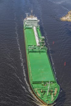 Cargo ship Kalkvik  going to the port of Halden, Norway in order to unload clay. The picture is shot from Svinesund Bridge.