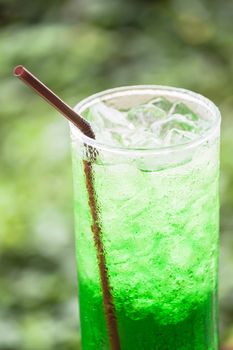 Non alcohol green drink with ice cubes