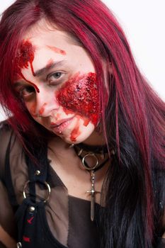 Red haired gothic girl with halloween makeup