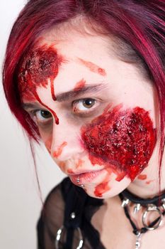 Red haired gothic girl with halloween makeup