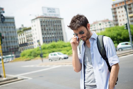 man in the street on the phone in the morning