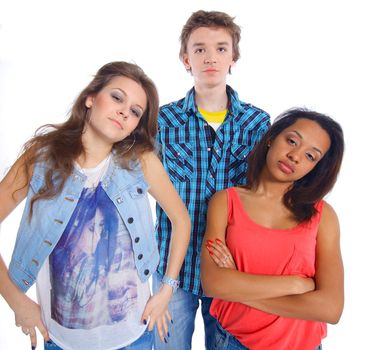 Portrait of three young teenagers grimacing. Isolated on white background.