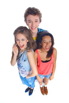 Three young teenagers laughing. Isolated on white background.