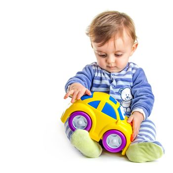 Lovely baby playing with his toy