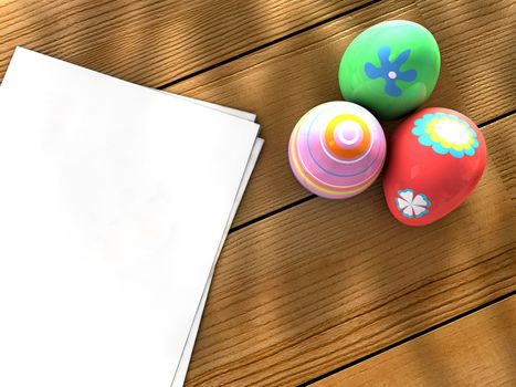 Colorful Easter eggs on a table next to notebook sheets