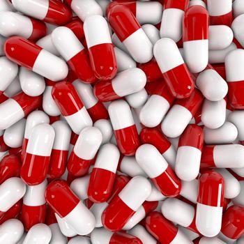 Red and white pills on a pile